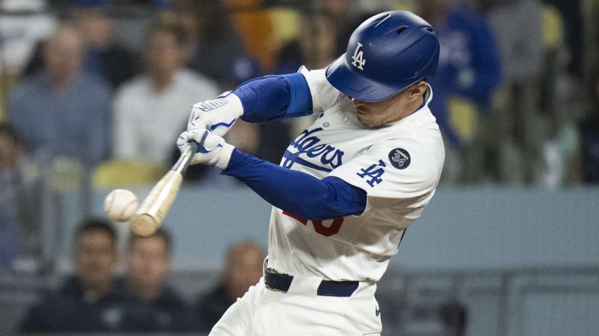 Los Angeles Dodgers' Tommy Edman hits a two-run double during the sixth inning of a baseball game against the Miami Marlins in Los Angeles, Tuesday, April 29, 2025.
