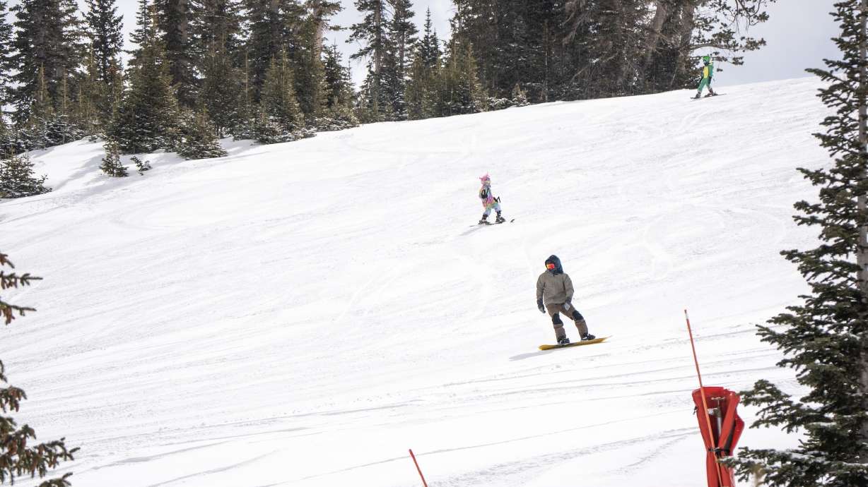 A snowboarder slides down a slope at Brian Head Resort on April 18. Five to 15 inches of snow could fall in the southern mountains between Sunday and Tuesday with the latest storm arriving in Utah.