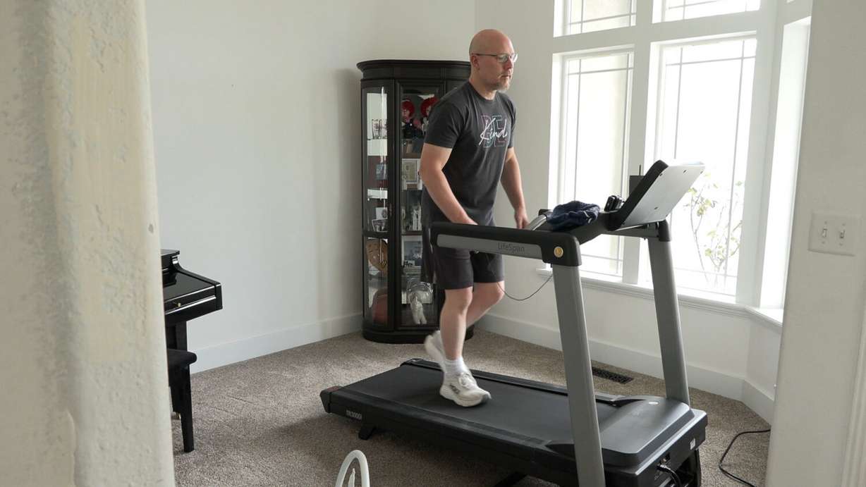 Philip Clark exercises in his home. Clark is part of a study taking place in Salt Lake City that is attempting to determine if high-intensity exercise slows the progression of Parkinson's disease.