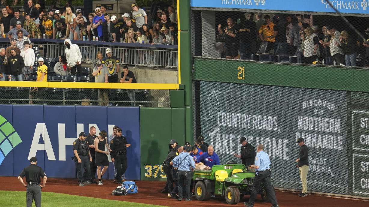 A fan is carted off the field at PNC Park after falling out of the stands during the seventh inning of a baseball game between the Pittsburgh Pirates and the Chicago Cubs in Pittsburgh, Wednesday, April 30, 2025.