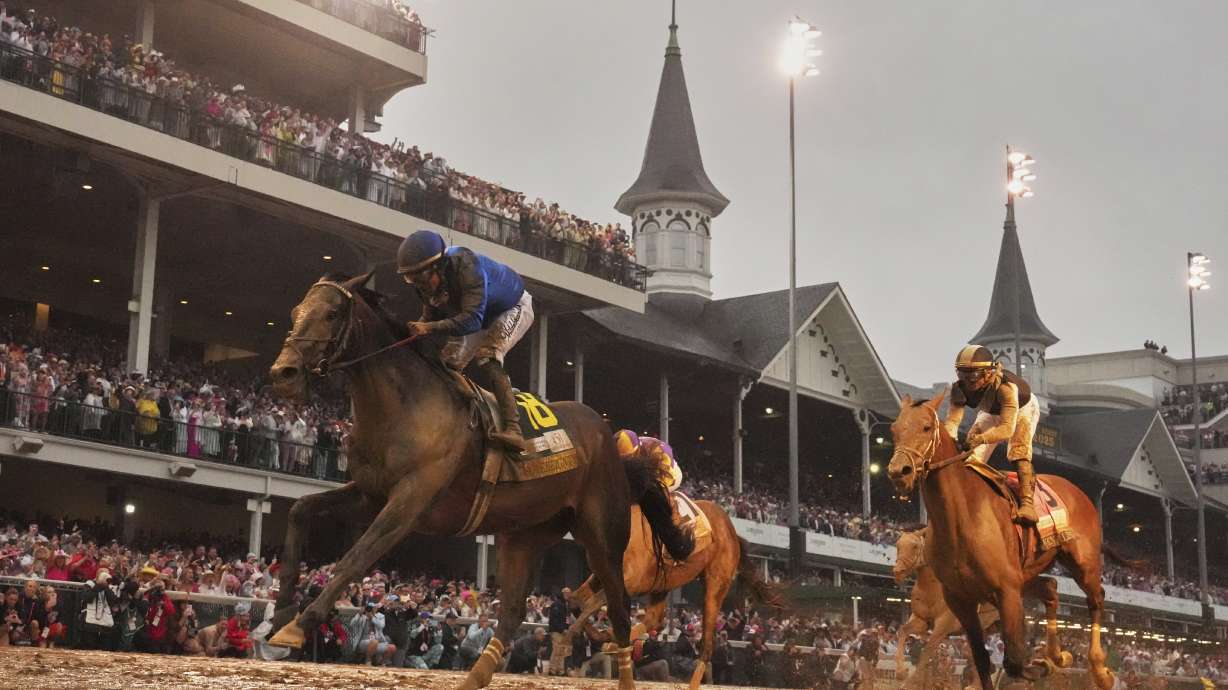 Sovereignty, ridden by Junior Alvarado, left, crosses the finish line to win the 151st running of the Kentucky Derby horse race at Churchill Downs Saturday, May 3, 2025, in Louisville, Ky.