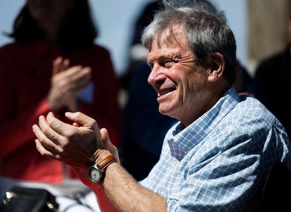 Dave Livermore, the former director and founder of the Utah chapter of The Nature Conservancy, claps and smiles while at a retirement celebration in his honor, at the Great Salt Lake Shorelands Preserve in Layton on April 22.