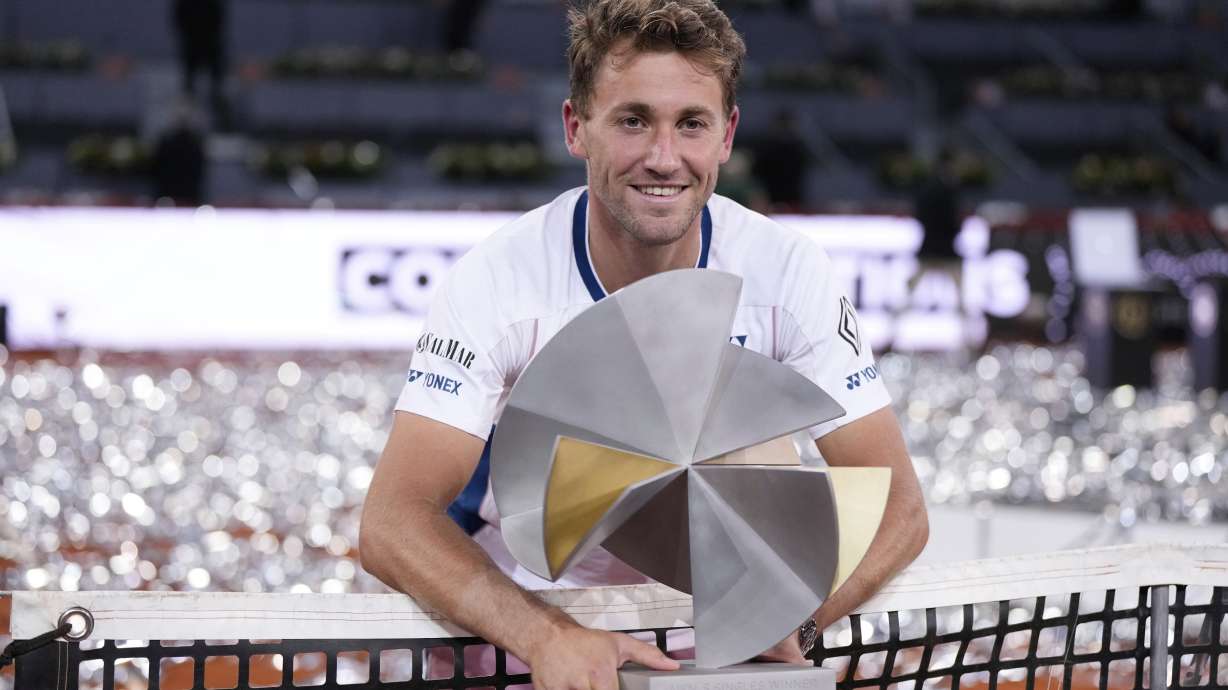 Norway's Casper Ruud holds the trophy after winning the Madrid Open tennis final in Madrid, Spain, Sunday, May 4, 2025.