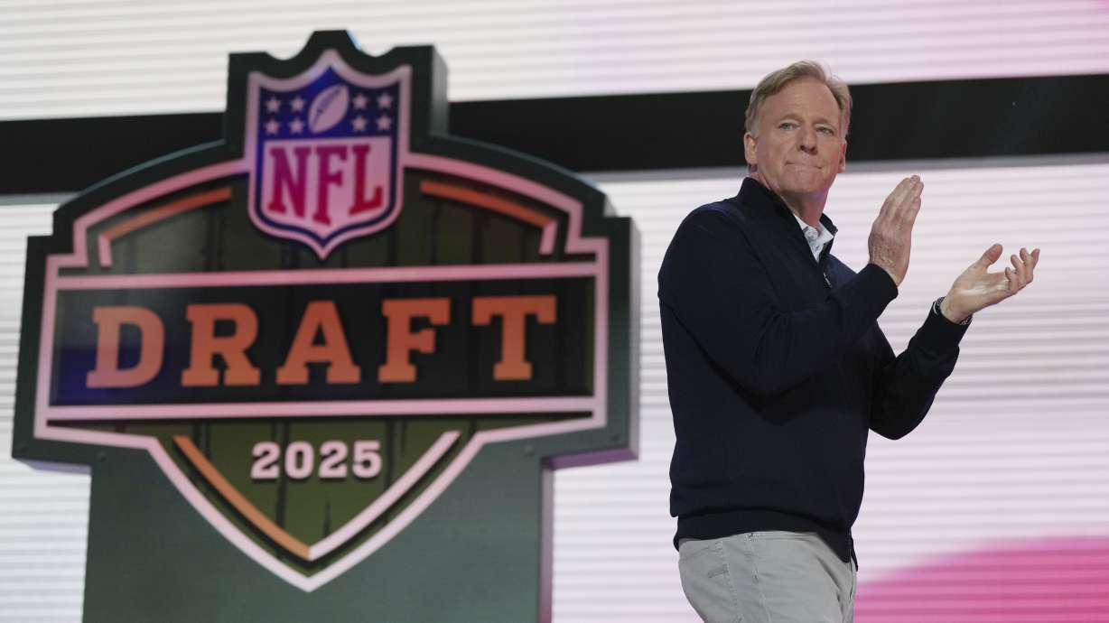 NFL Commissioner Roger Goodell motions on stage during the second round of the NFL football draft, Friday, April 25, 2025, in Green Bay, Wis.