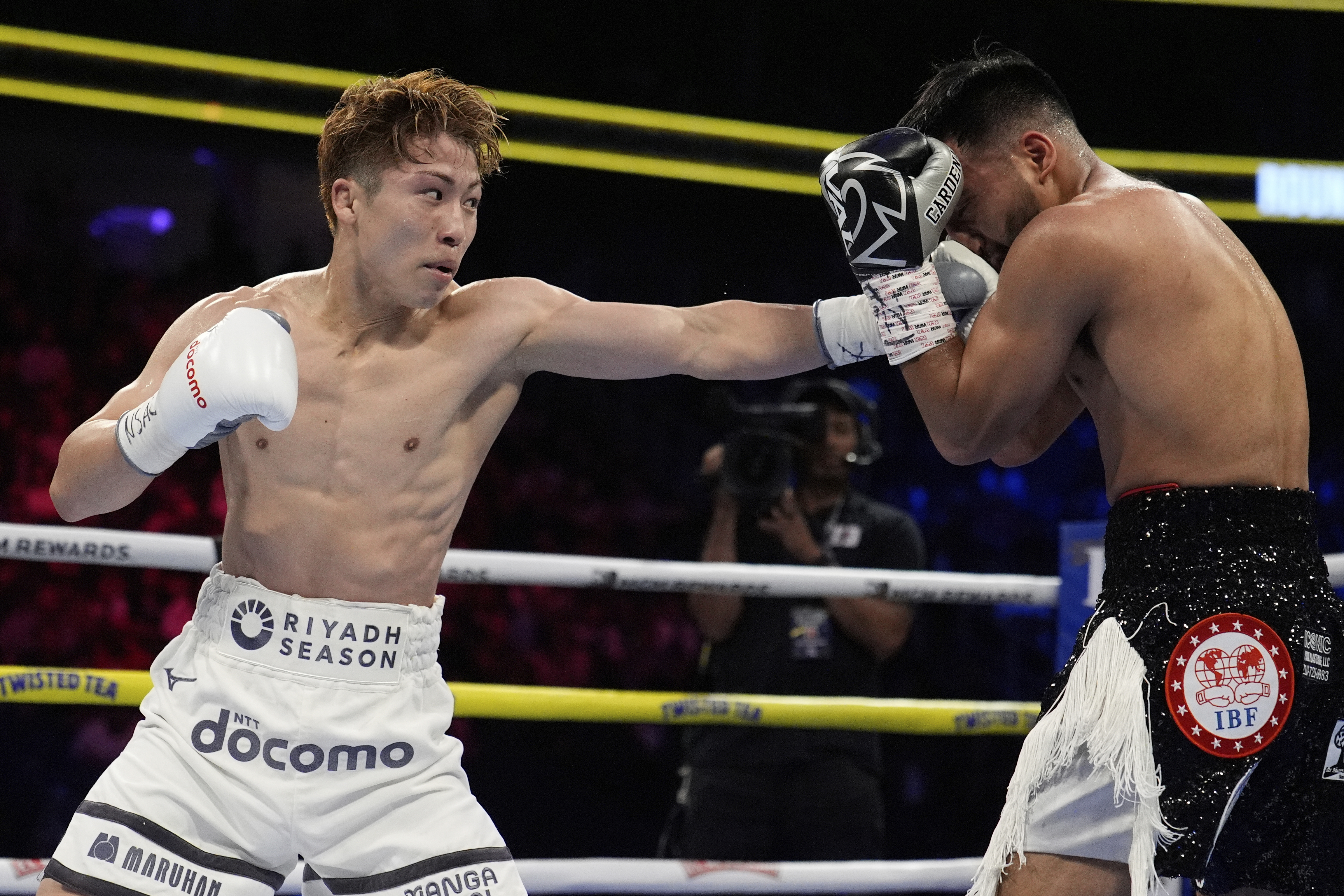 Naoya Inoue hits Ramon Cardenas in a junior featherweight title boxing match Sunday, May 4, 2025, in Las Vegas. 