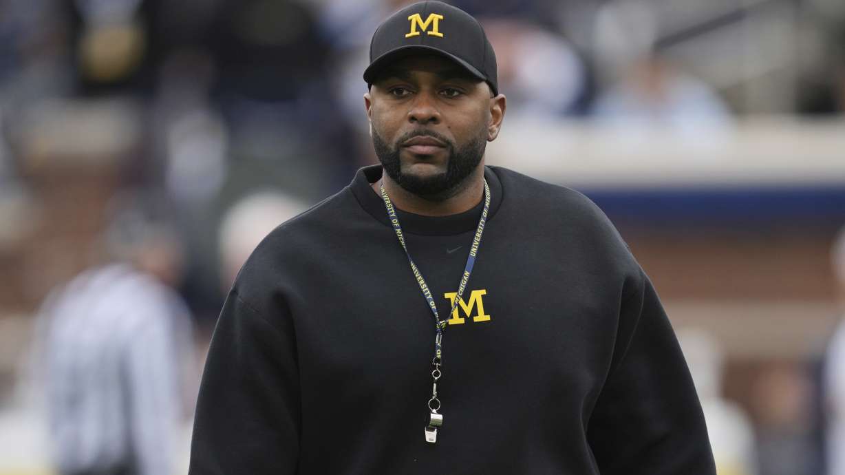 Michigan head coach Sherrone Moore watches during an NCAA college football spring game in Ann Arbor, Mich., Saturday, April 19, 2025.