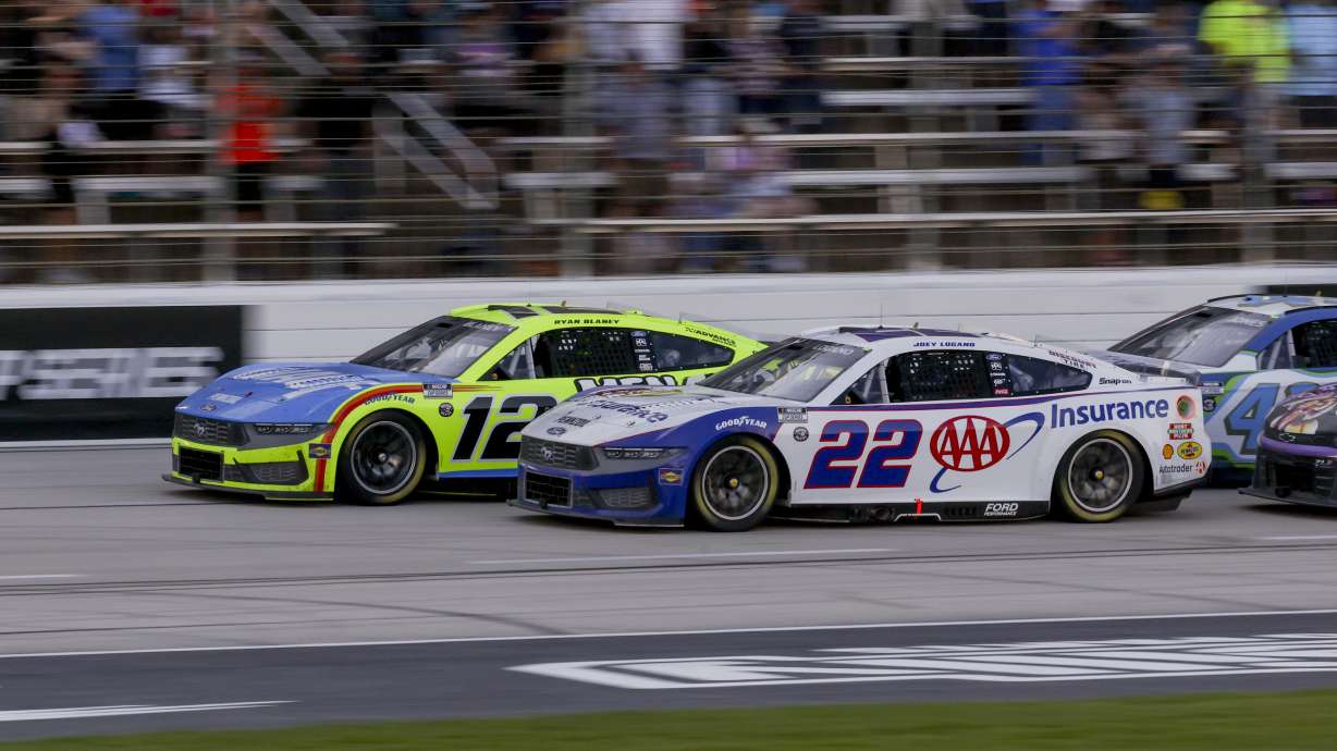 Ryan Blaney (12) and Joey Logano (22) lead the pack following a caution during a NASCAR Cup Series auto race at Texas Motor Speedway in Fort Worth, Texas, Sunday, May 4, 2025.