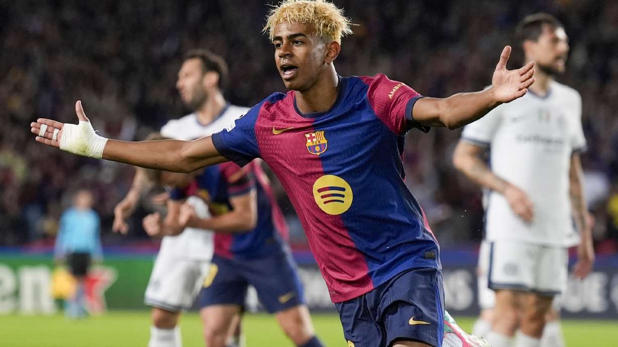 Barcelona's Lamine Yamal celebrates after scoring during the Champions League semifinal first leg soccer match between Barcelona and Inter Milan in Barcelona, Spain, Wednesday, April 30, 2025. AP Photo/Emilio Morenatti)
