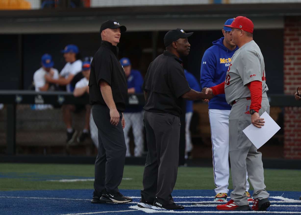 First-year Nicholls State baseball head coach Brent Haring shakes hands with the umpire crew prior to a game during the 2025 season.