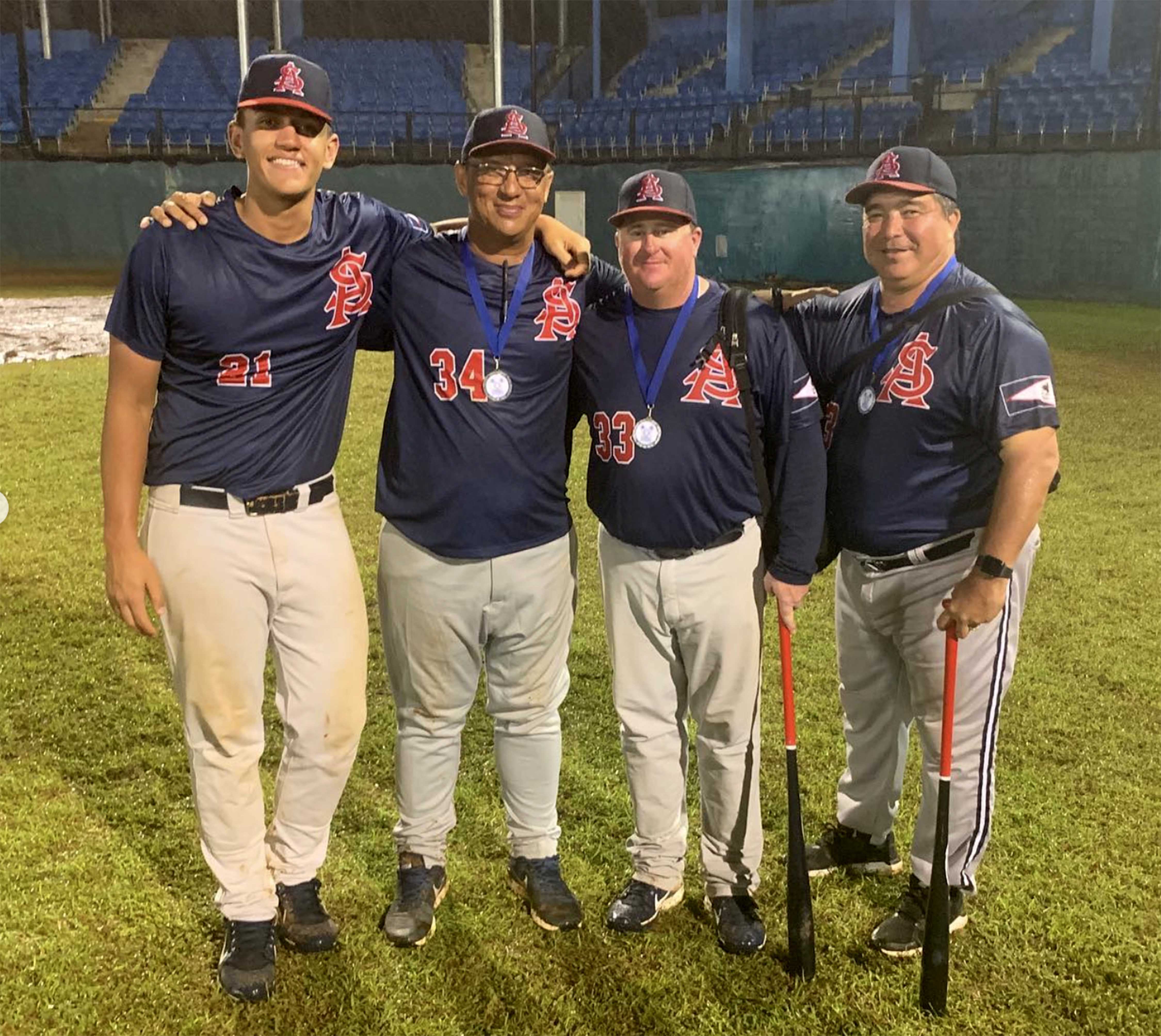St. George native Brent Haring, second from right, spent several years as the skipper of the American Samoa National Baseball Team.