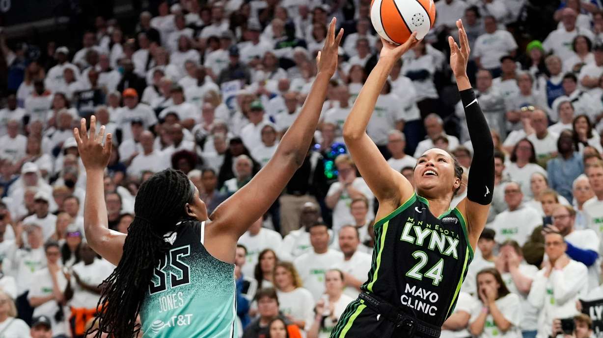 FILE - Minnesota Lynx forward Napheesa Collier (24) shoots over New York Liberty forward Jonquel Jones (35) during the second half in Game 3 of a WNBA basketball final playoff series, Wednesday, Oct. 16, 2024, in Minneapolis.