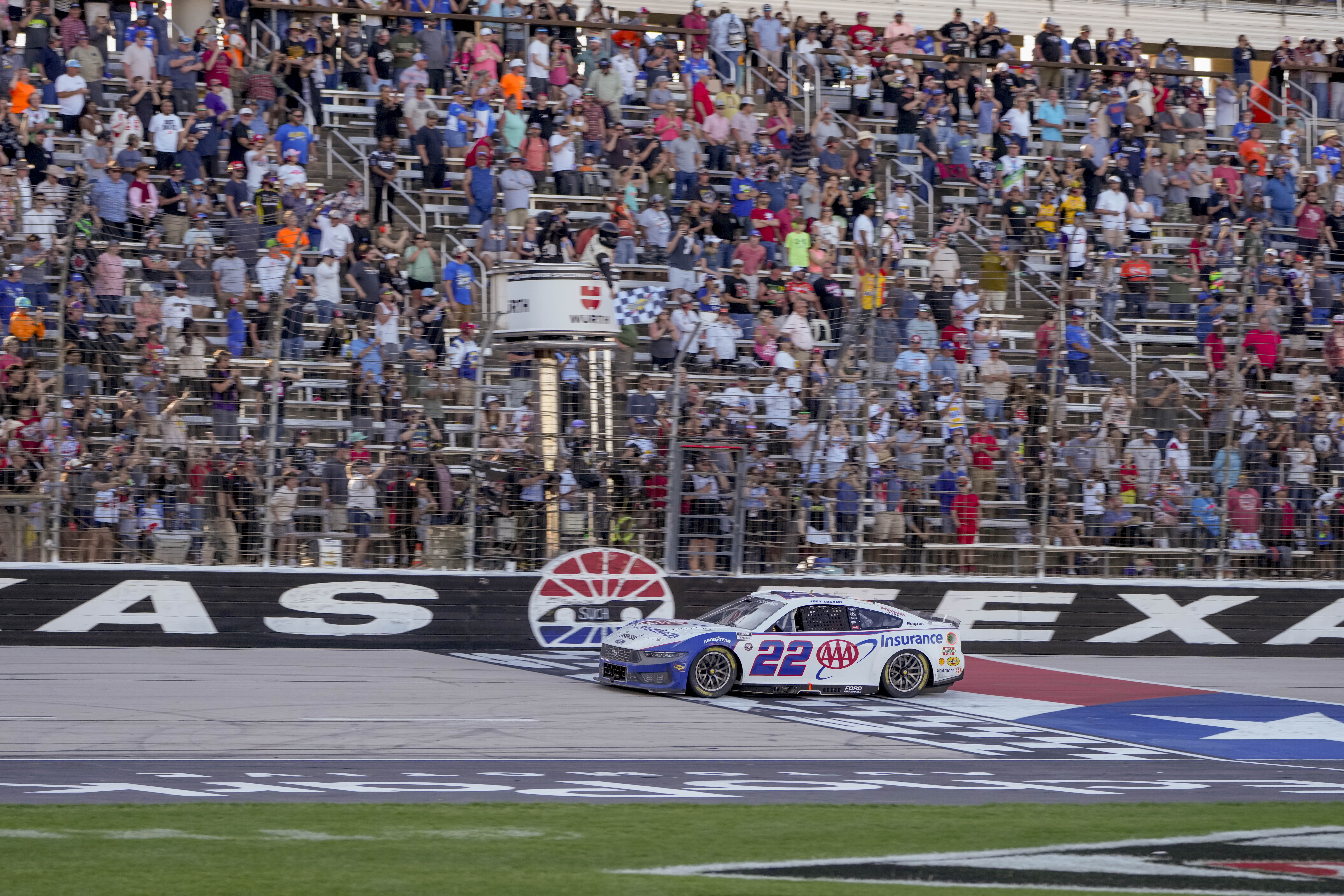 Joey Logano crosses the finish line to win a NASCAR Cup Series auto race at Texas Motor Speedway in Fort Worth, Texas, Sunday, May 4, 2025.