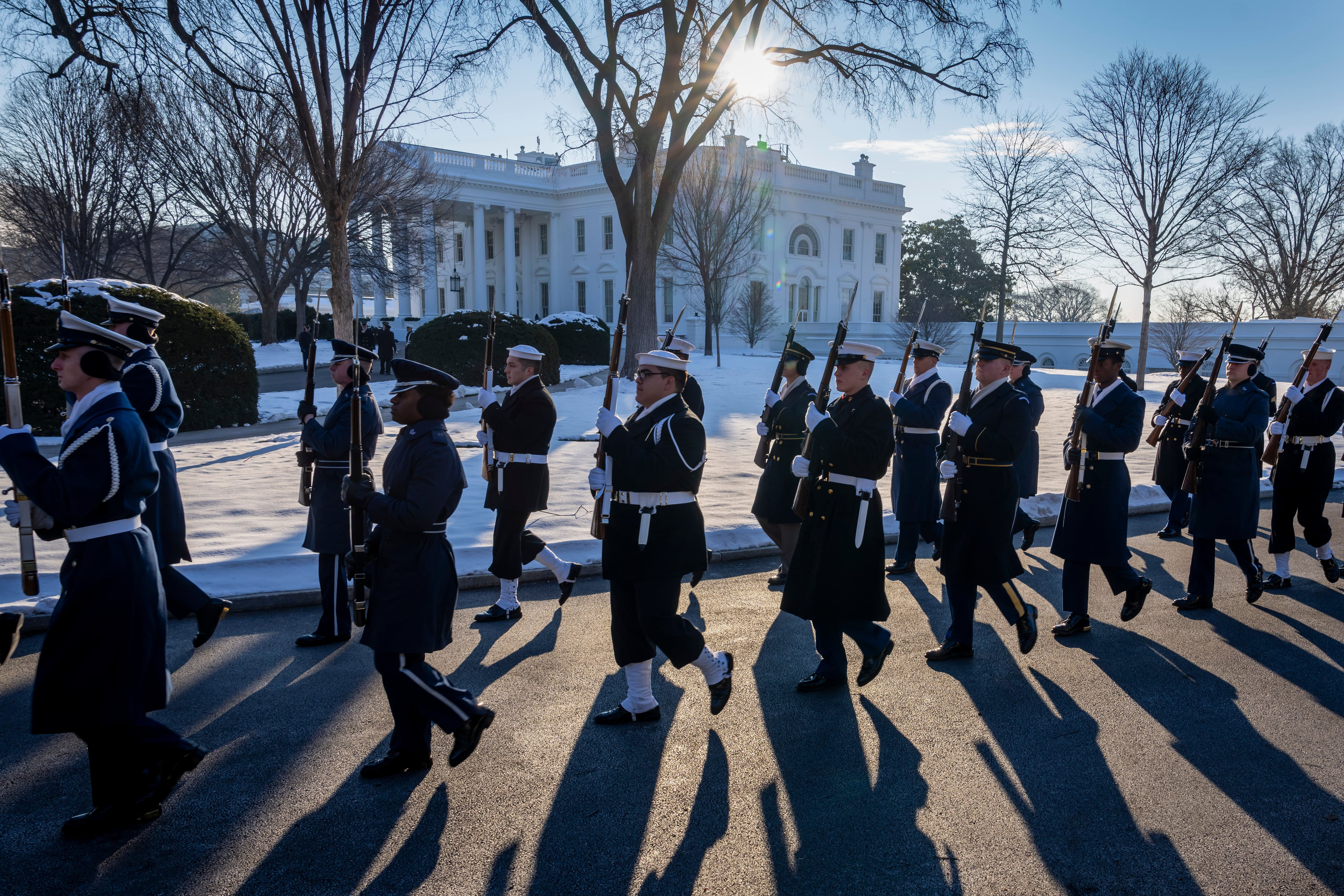Members of the U.S. military Joint Honor Guard parade as they rehearse ahead of the upcoming presidential inauguration, at the North Lawn in front of the White House in Washington, Jan. 12. A massive military parade is slated for June 14 — Flag Day, as well as President Donald Trump's 79th birthday.
