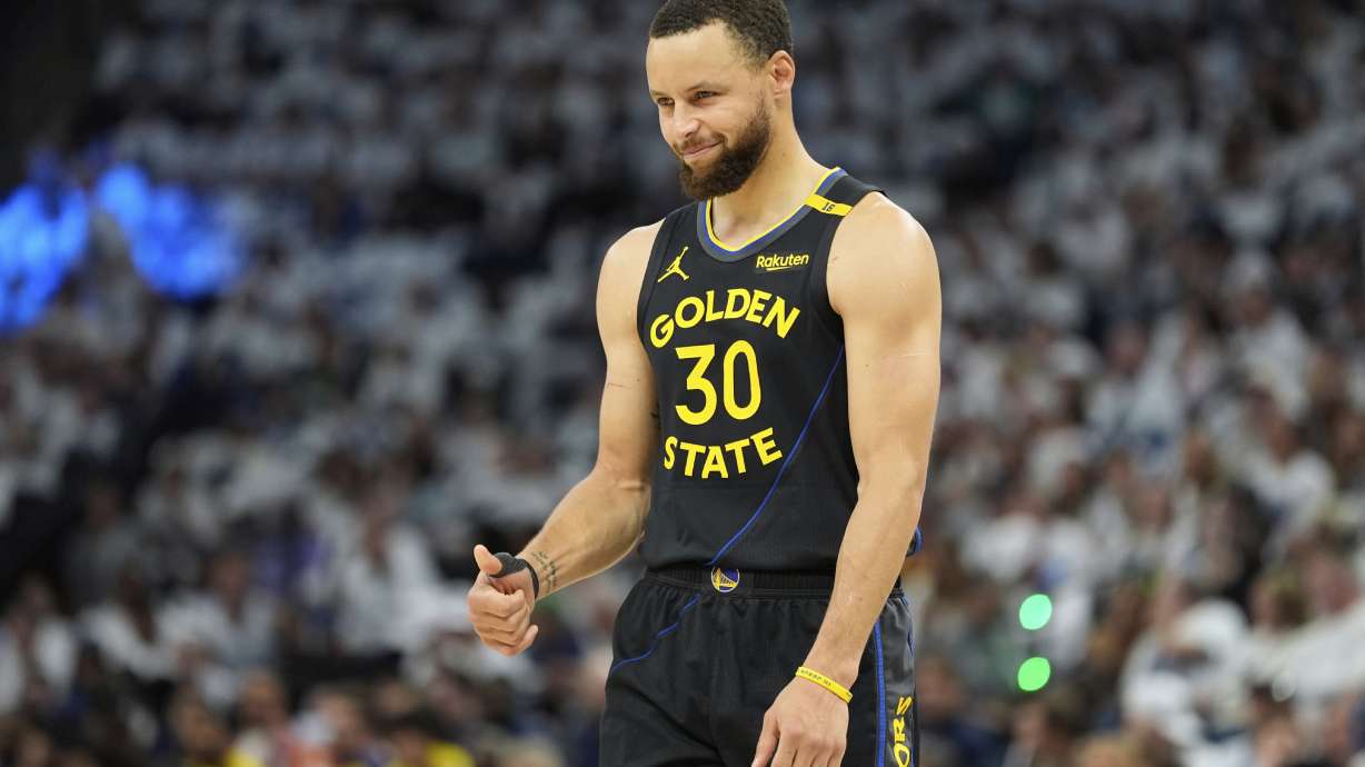 Golden State Warriors guard Stephen Curry (30) gestures during the first half of Game 1 of an NBA basketball second-round playoff series against the Minnesota Timberwolves, Tuesday, May 6, 2025, in Minneapolis.