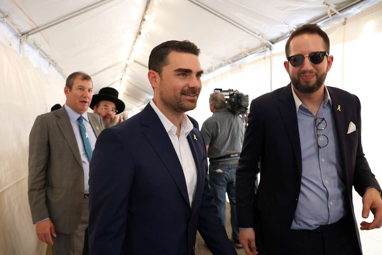 FILE - Ben Shapiro, center, leaves the Ohel Chabad-Lubavitch after a visit from Republican presidential nominee former President Donald Trump, Oct. 7, 2024, in New York. (AP Photo/Yuki Iwamura, File)