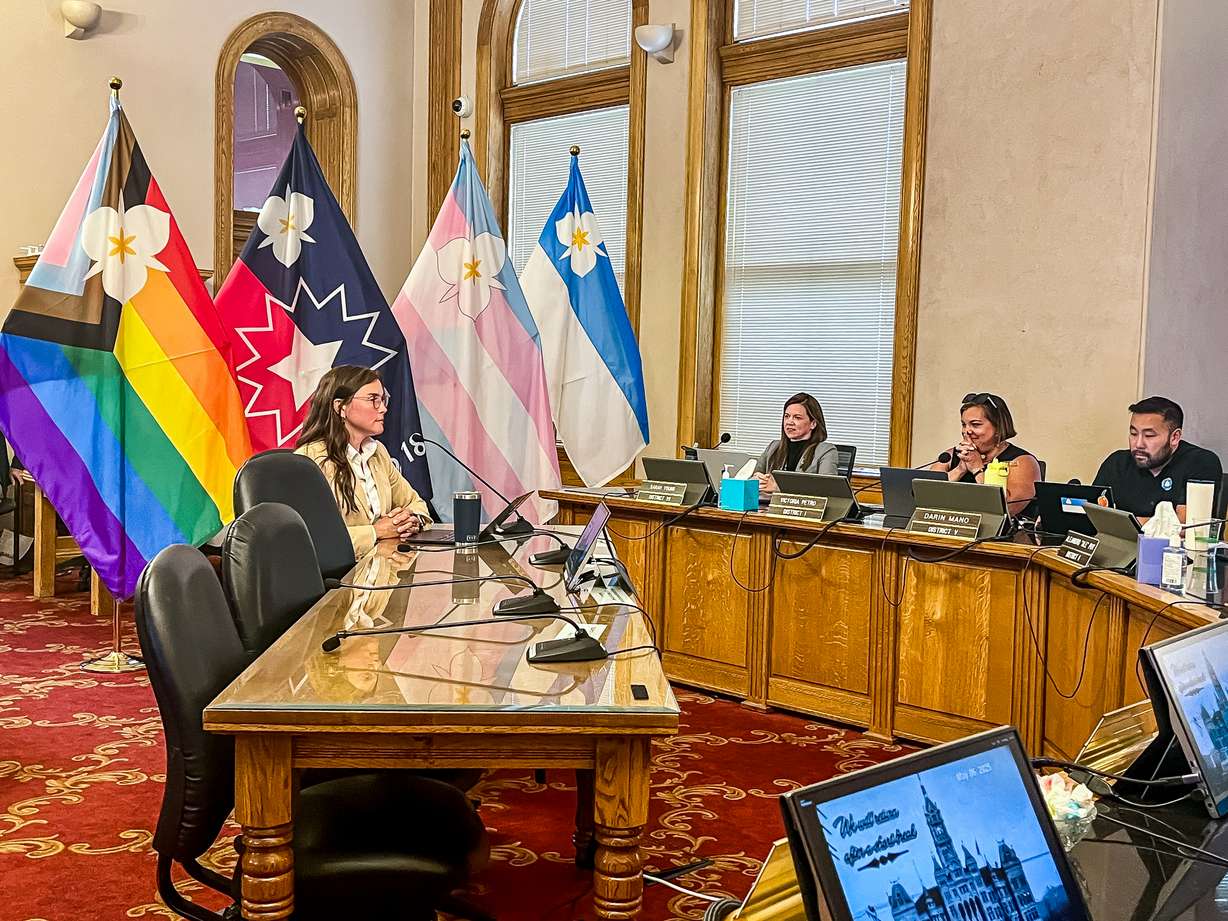 Salt Lake City Mayor Erin Mendenhall unveils three new city flag designs to members of the Salt Lake City Council on May 6. The City Council adopted the designs later that evening, allowing the city to continue flying LGBTQ and Juneteenth symbols in the city.