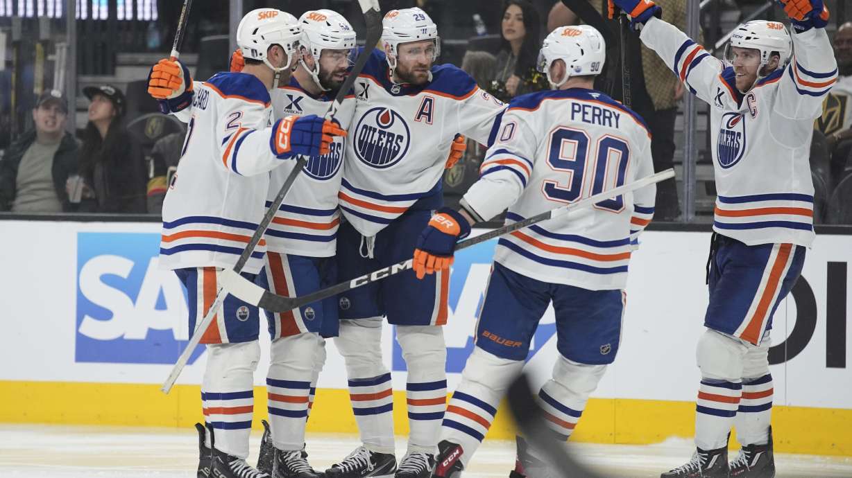 Edmonton Oilers center Leon Draisaitl (29) celebrates with teammates after scoring against the Vegas Golden Knights during the third period of Game 1 of a second-round NHL hockey playoff series Tuesday, May 6, 2025, in Las Vegas.