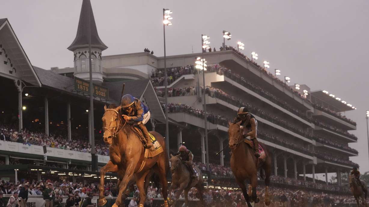 Sovereignty, ridden by Junior Alvarado, left, crosses the finish line to win the 151st running of the Kentucky Derby horse race at Churchill Downs Saturday, May 3, 2025, in Louisville, Ky.