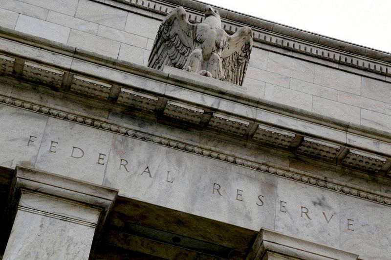 Fed stands pat but sees higher inflation and growth risks