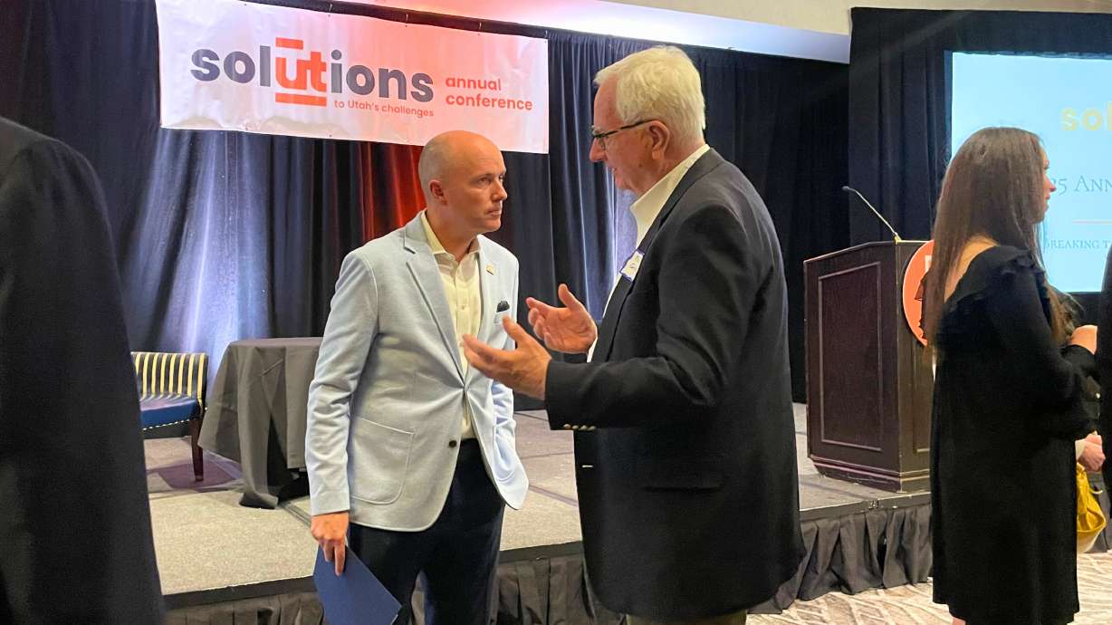 Utah Gov. Spencer Cox at the annual Solutions Utah conference in Salt Lake City on Wednesday. Cox spoke at the event in a forum with journalist Sam Quinones about the connection between homelessness, crime and drugs.