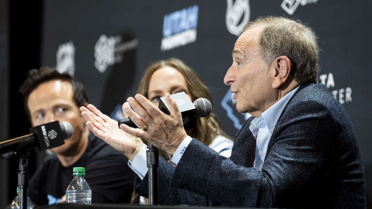 NHL commissioner Gary Bettman speaks while joined by Ryan and Ashley Smith, co-owners of the Utah Mammoth and Smith Entertainment Group, during a press conference announcing the Utah Hockey Club is changing their name to Utah Mammoth at the Delta Center in Salt Lake City on Wednesday, May 7, 2025.