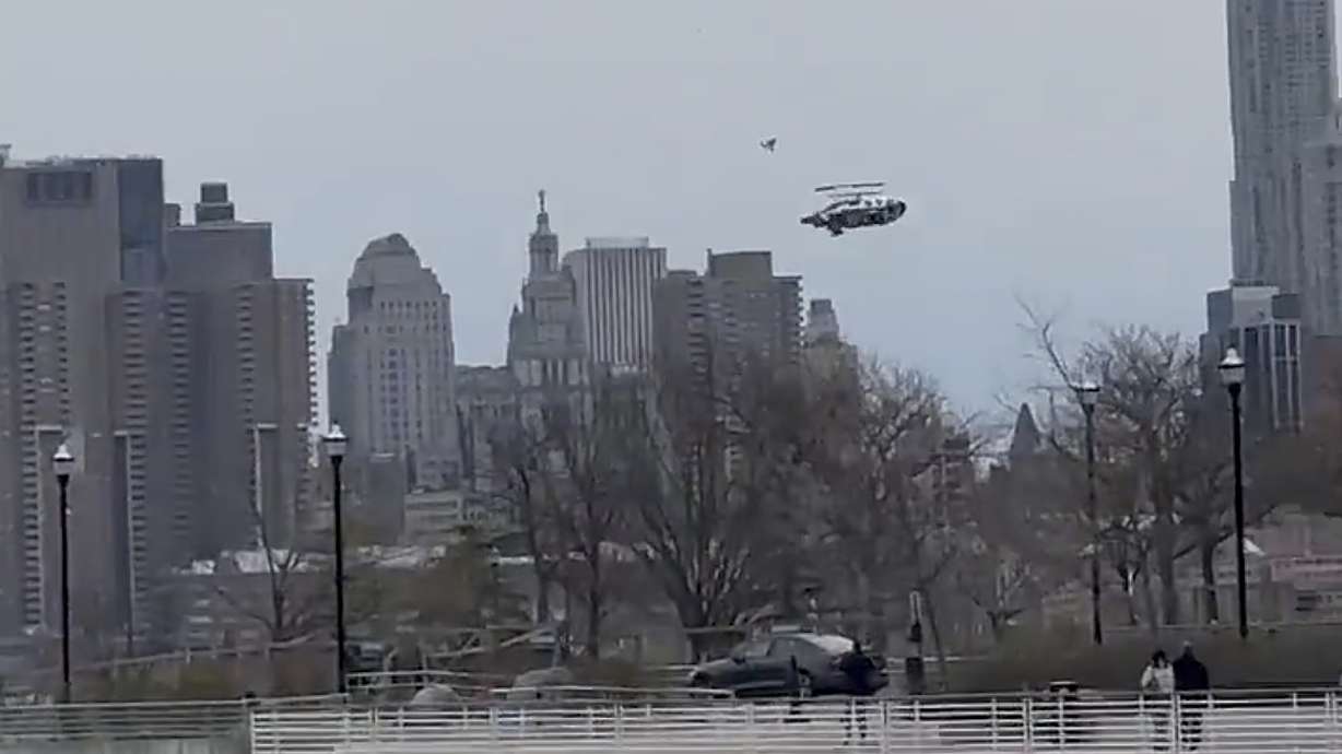A helicopter falls from the sky into the Hudson River on April 10 in Jersey City, N.J. Federal officials on Wednesday released images of the doomed chopper as it broke apart in midair last month, killing six people.