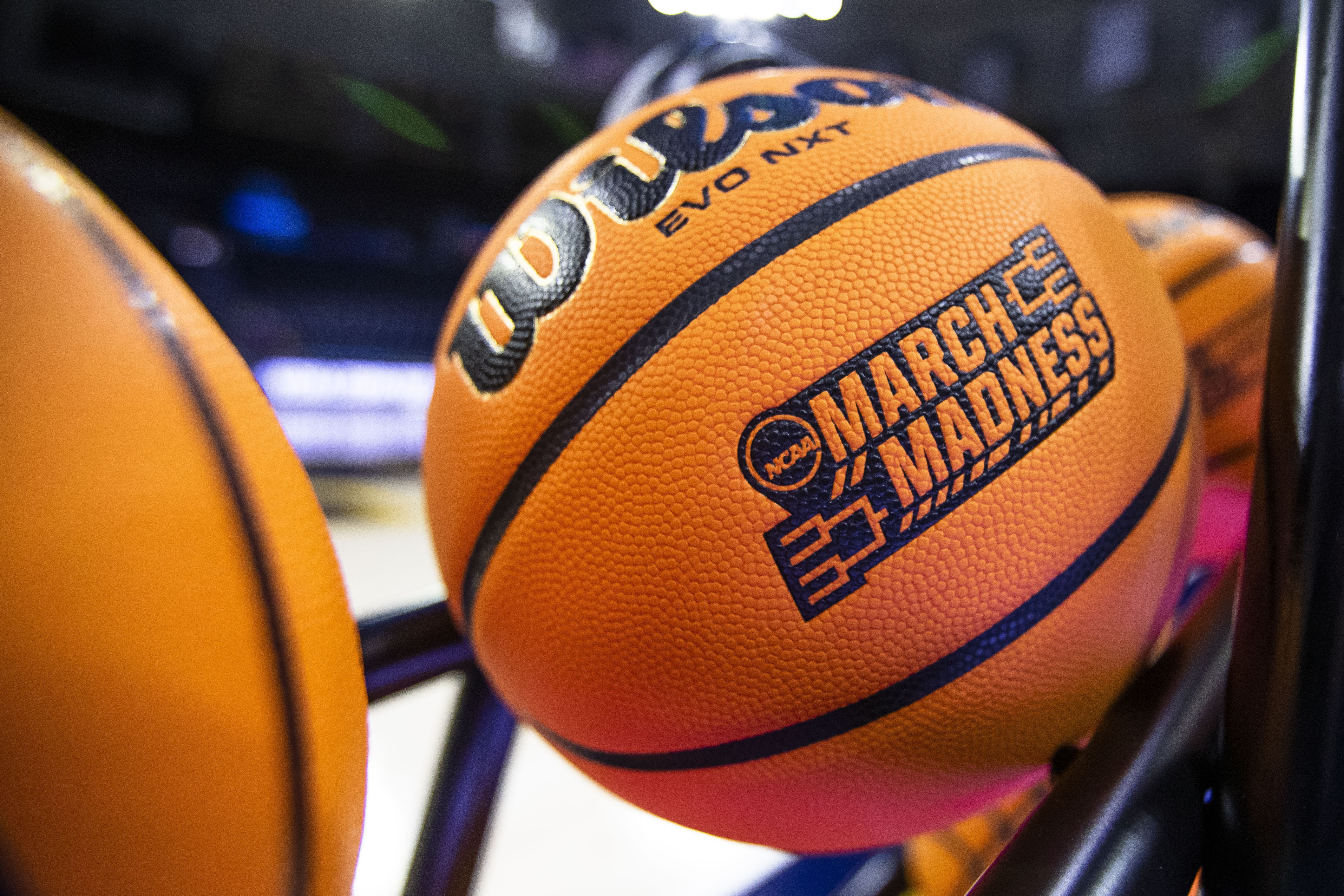 FILE - A basketball with a March Madness logo rests on a rack before a First Four game between Illinois and Mississippi State in the NCAA women's basketball tournament, March 15, 2023, in South Bend, Ind.