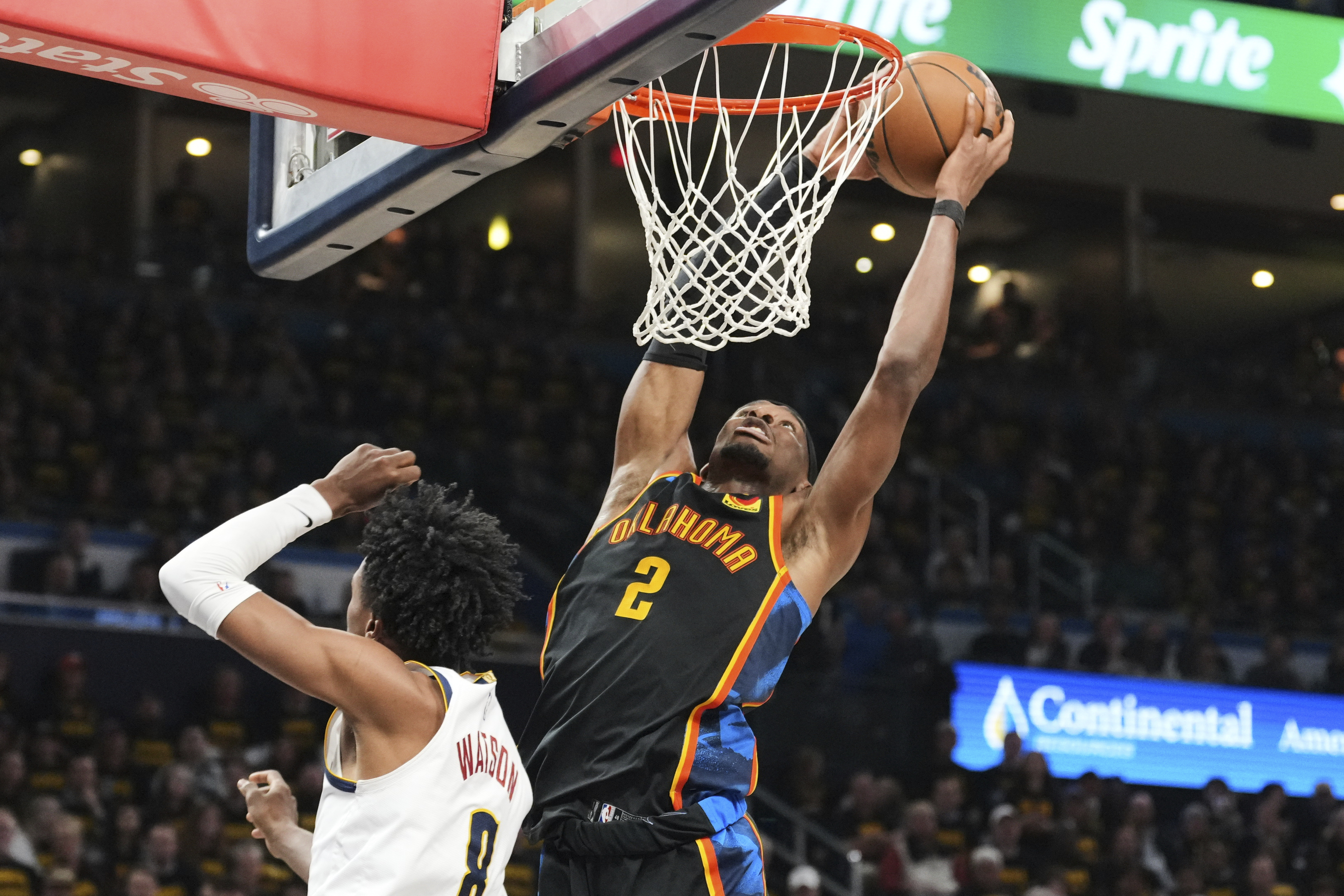 Oklahoma City Thunder guard Shai Gilgeous-Alexander (2) leaps to the basket for a shot over Denver Nuggets' Peyton Watson (8) in the second half of Game 2 in the conference semifinals of the NBA basketball playoffs, Wednesday, May 7, 2025, in Oklahoma City. 