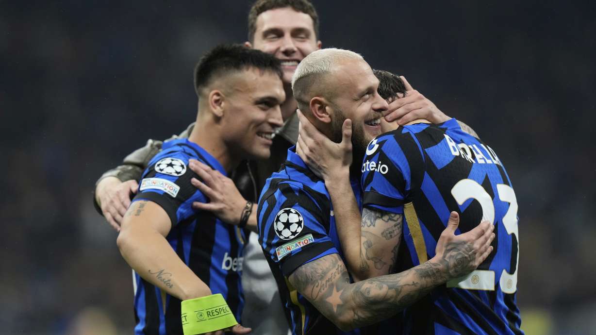 Inter Milan players celebrate at the end of the Champions League semifinal second leg soccer match between Inter Milan and Barcelona at San Siro stadium in Milan , Italy, Tuesday, May 6, 2025.