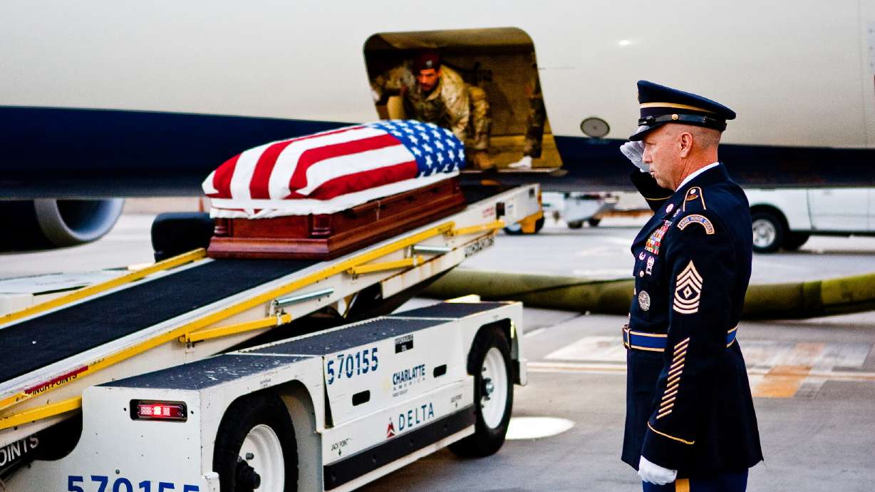 U.S. Army First Sgt. Corey Bybee honors a fallen veteran. Bybee and his team travel across Utah to assist in funerals, help with the Utah Honor Flight trips, and pay respects to the unknown soldiers.