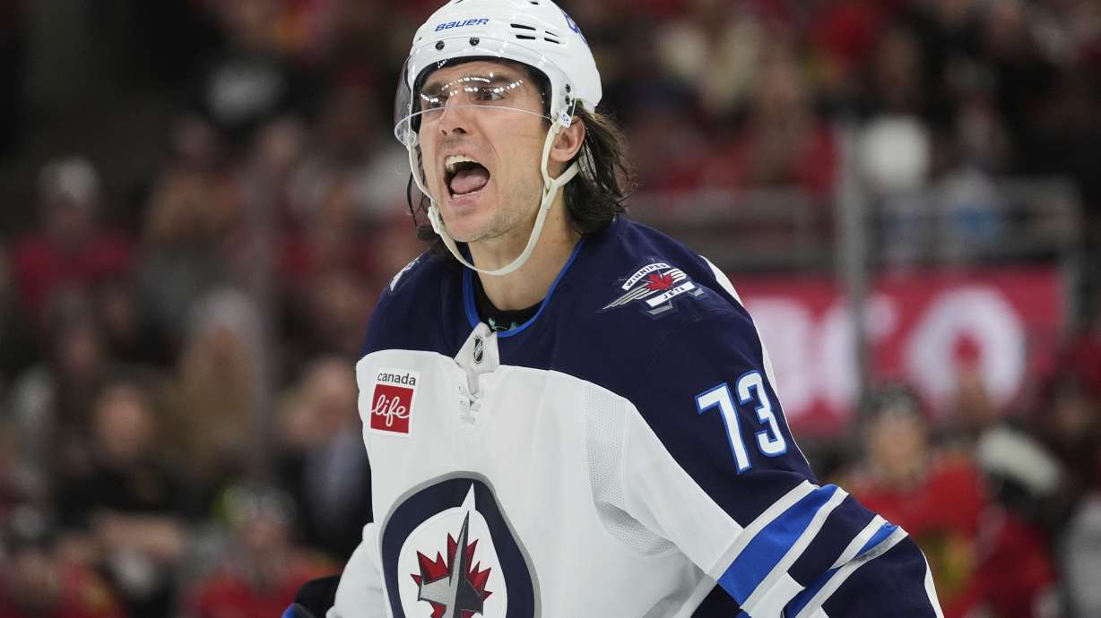 Winnipeg Jets left wing Brandon Tanev argues with an official during the first period of an NHL hockey game against the Chicago Blackhawks, Saturday, April 12, 2025, in Chicago.