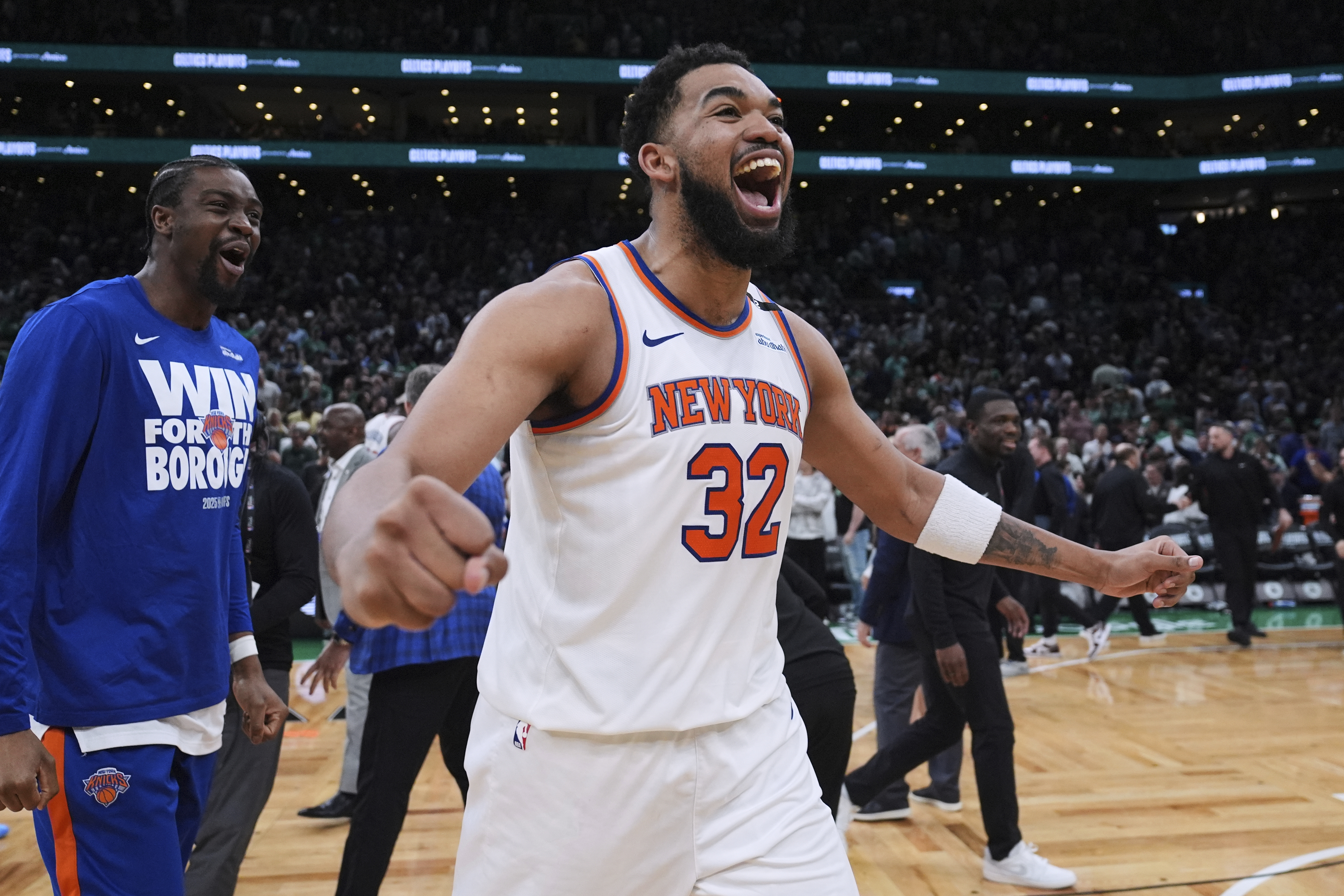 New York Knicks center Karl-Anthony Towns (32) celebrates after defeating the Boston Celtics in Game 2 of an NBA basketball second-round playoff series Wednesday, May 7, 2025, in Boston. 