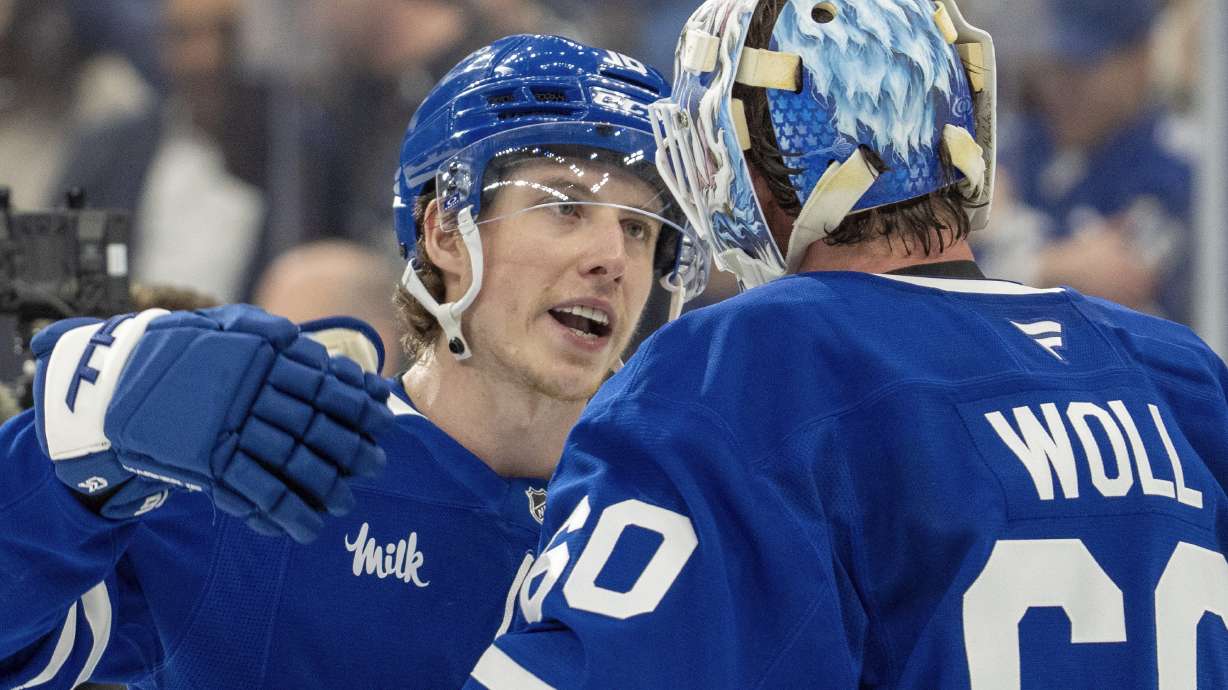 Toronto Maple Leafs' Mitch Marner (16) celebrates with goaltender Joseph Woll (60) after defeating the Florida Panthers in NHL playoff hockey action in Toronto on Wednesday, May 7, 2025.