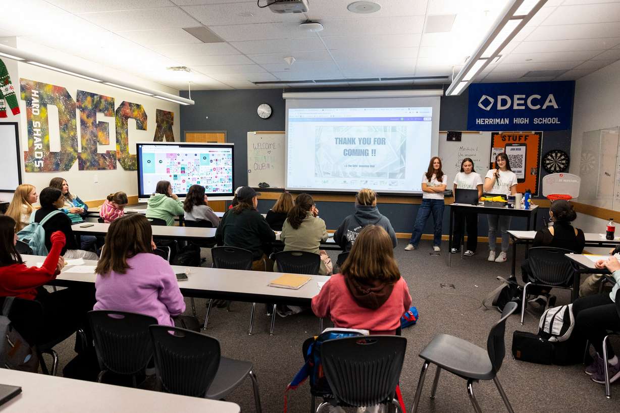 Founders and co-presidents of the Girls Investing Club, from left to right, at the front of the room, Baylee Zuniga, Kaylee Arsenault and Elizabeth Anderson, close out a club meeting at Herriman High School in Herriman on Oct. 18, 2024. All three girls said they started the club after noticing a lack of financial literacy knowledge among other girls in their class. They hope that through the club, they can prepare themselves and their fellow students with the financial knowledge to succeed after high school.