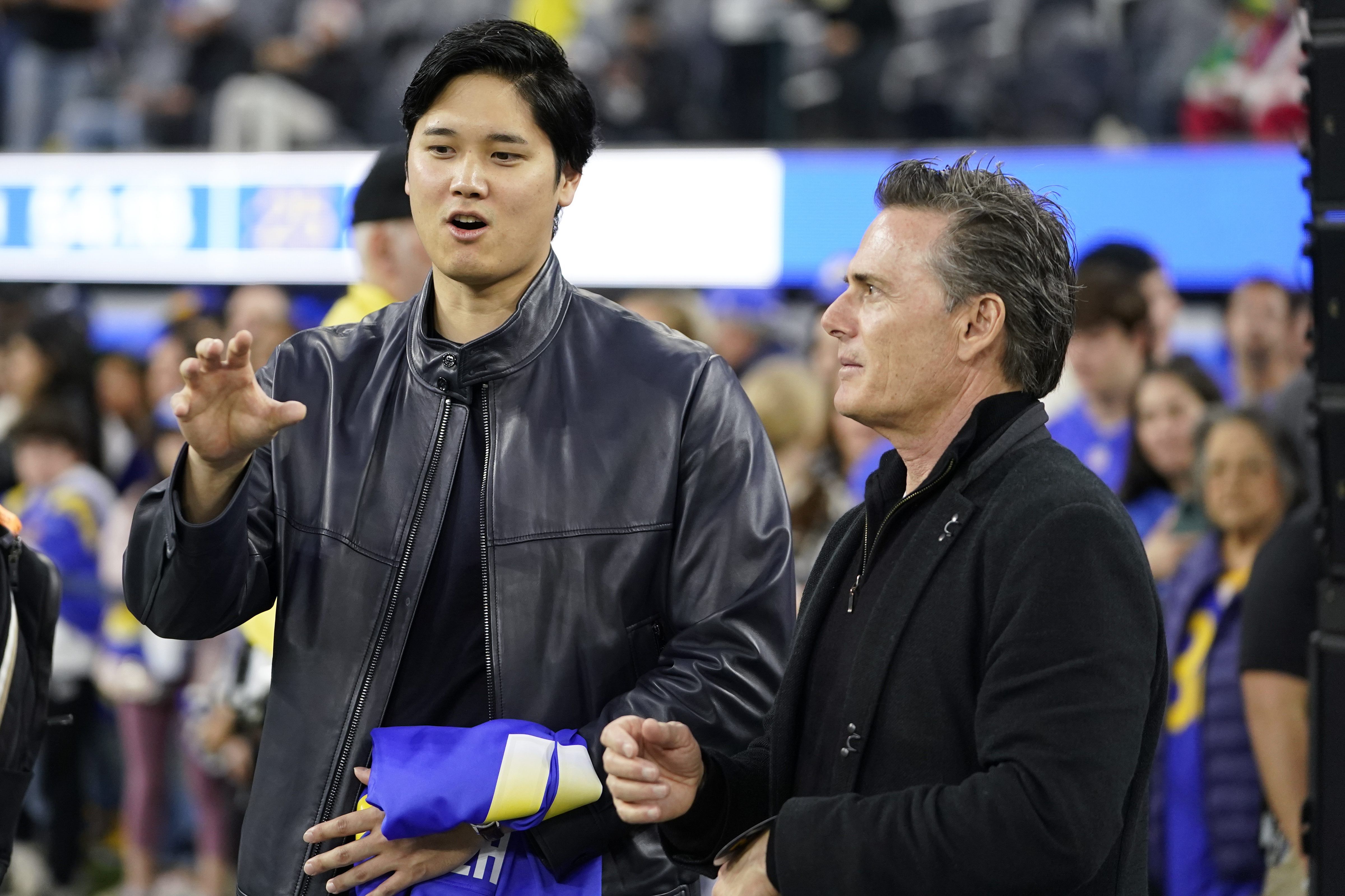 FILE - Los Angeles Dodgers' Shohei Ohtani and his agent Nez Balelo attend an NFL football game between the Los Angeles Rams and the New Orleans Saints, Thursday, Dec. 21, 2023, in Inglewood, Calif.
