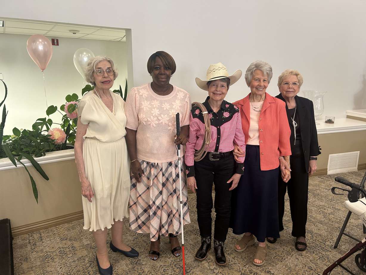 Judith Hyde, Cassandra Hopkins, Verlyn Baldwin, Phyllis Lewis and Reen Cathcart celebrate at a Mother's Day fashion show at Legacy Retirement Residence in South Jordan on Thursday.