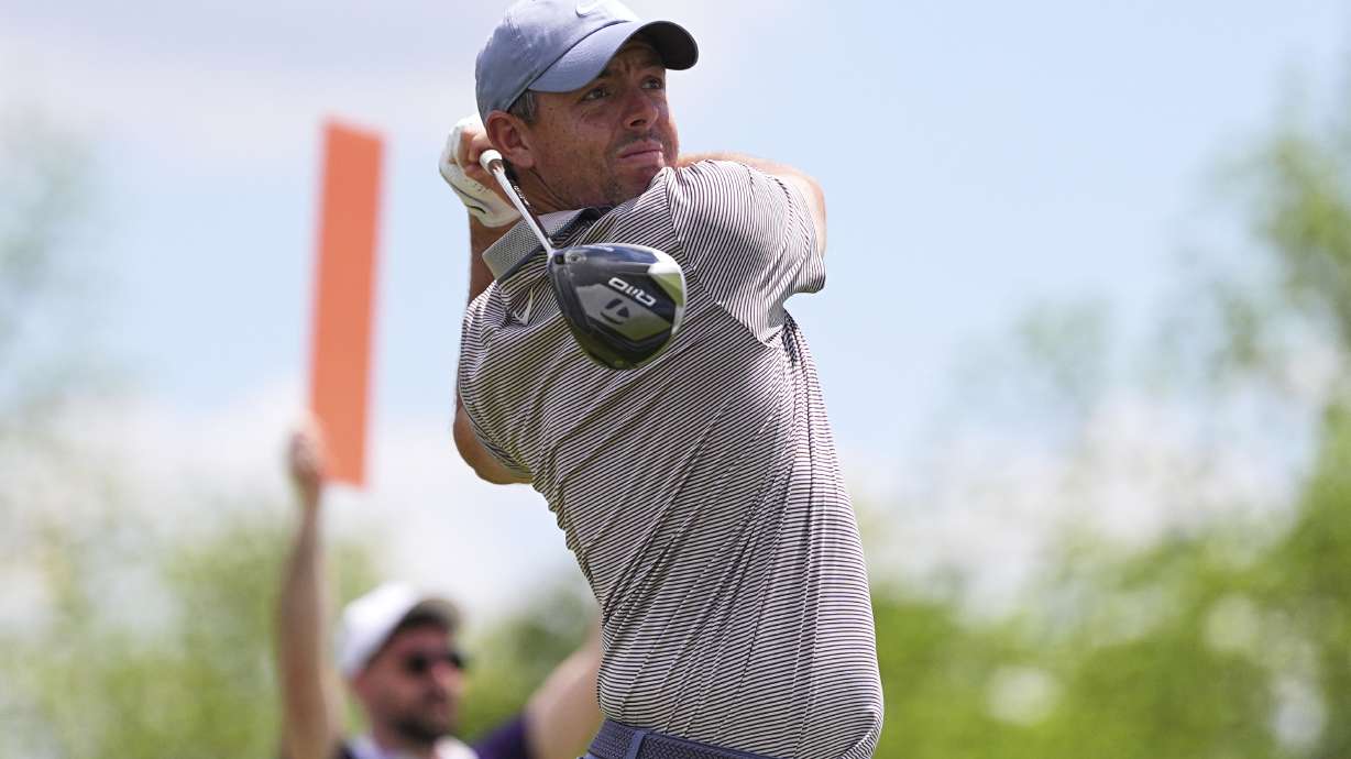 Rory McIlroy, of Northern Ireland, hits on the fourth hole during the first round of the Truist Championship golf tournament at the Philadelphia Cricket Club, Thursday, May 8, 2025, in Flourtown.