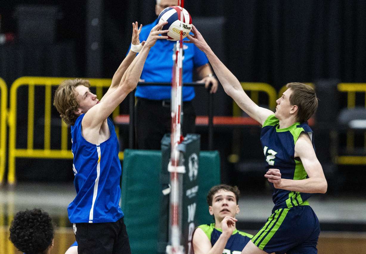 Orem middle hitter Luke Wolsey (6) and Timpanogos’ Jared Hansen (12) joust at the net during the high school boys volleyball 4A state championship game between Orem and Timpanogos at the UCCU Center at UVU in Orem on Thursday, May 8, 2025.