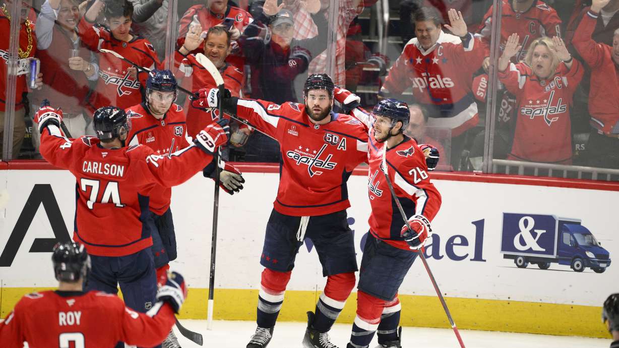 Washington Capitals right wing Tom Wilson, second from right, celebrates his goal in the third period of Game 2 of a second-round NHL hockey playoff series against the Carolina Hurricanes, Thursday, May 8, 2025, in Washington.