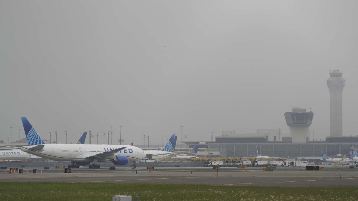 Fog covers planes and control towers at Newark Liberty International Airport in Newark, N.J., Monday. The air traffic controllers directing planes into the airport lost their radar Friday morning for the second time in two weeks.