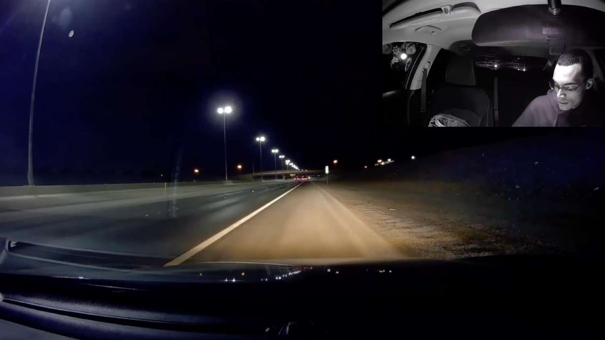 A speeding driver speaks with the police officer who pulled him over for going nearly 40 mph over the speed limit. The officer let the man off with a warning and a lecture on reckless driving.