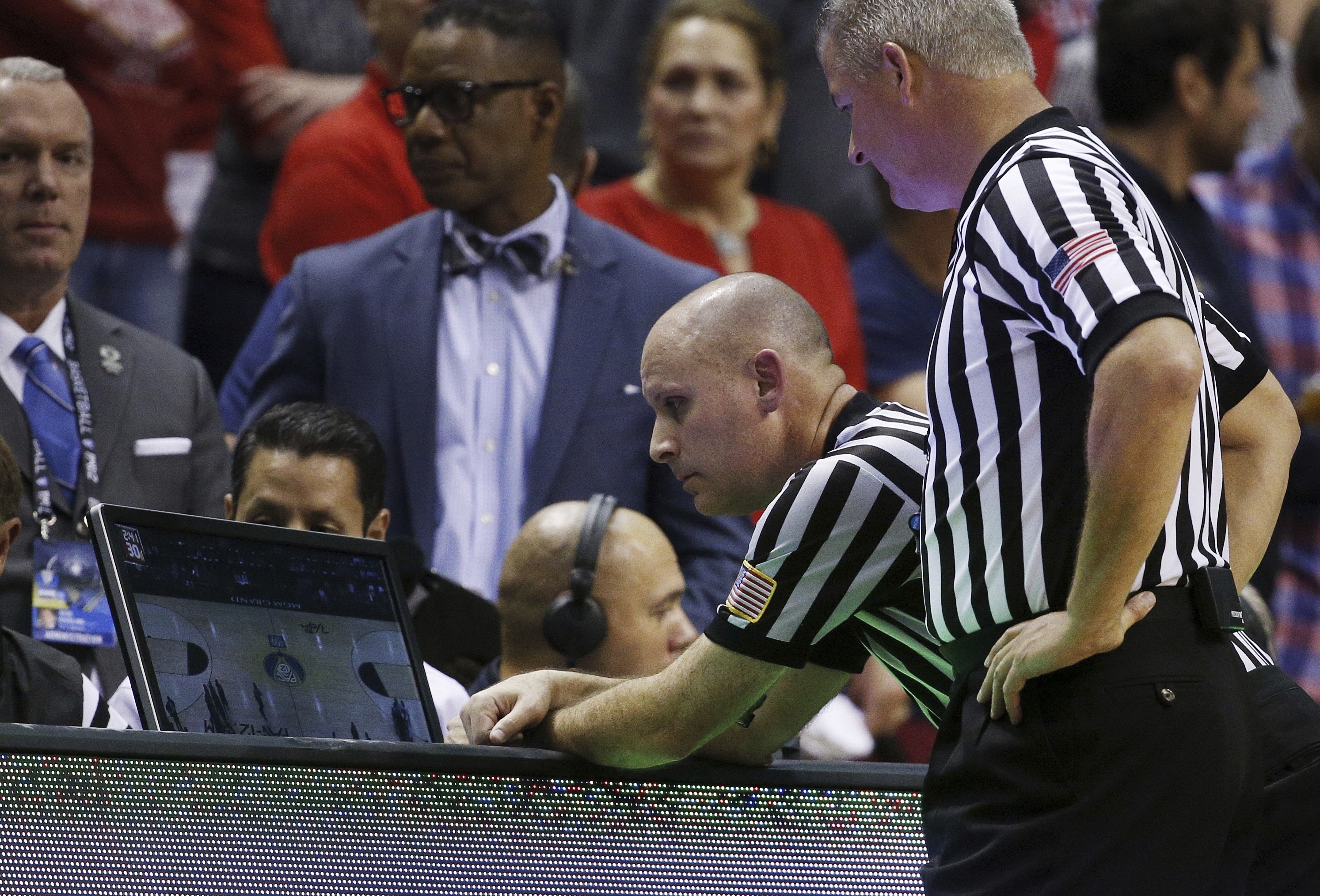 Out-of-bounds plays could be reviewed only by coach challenge under NCAA rules panel recommendation
