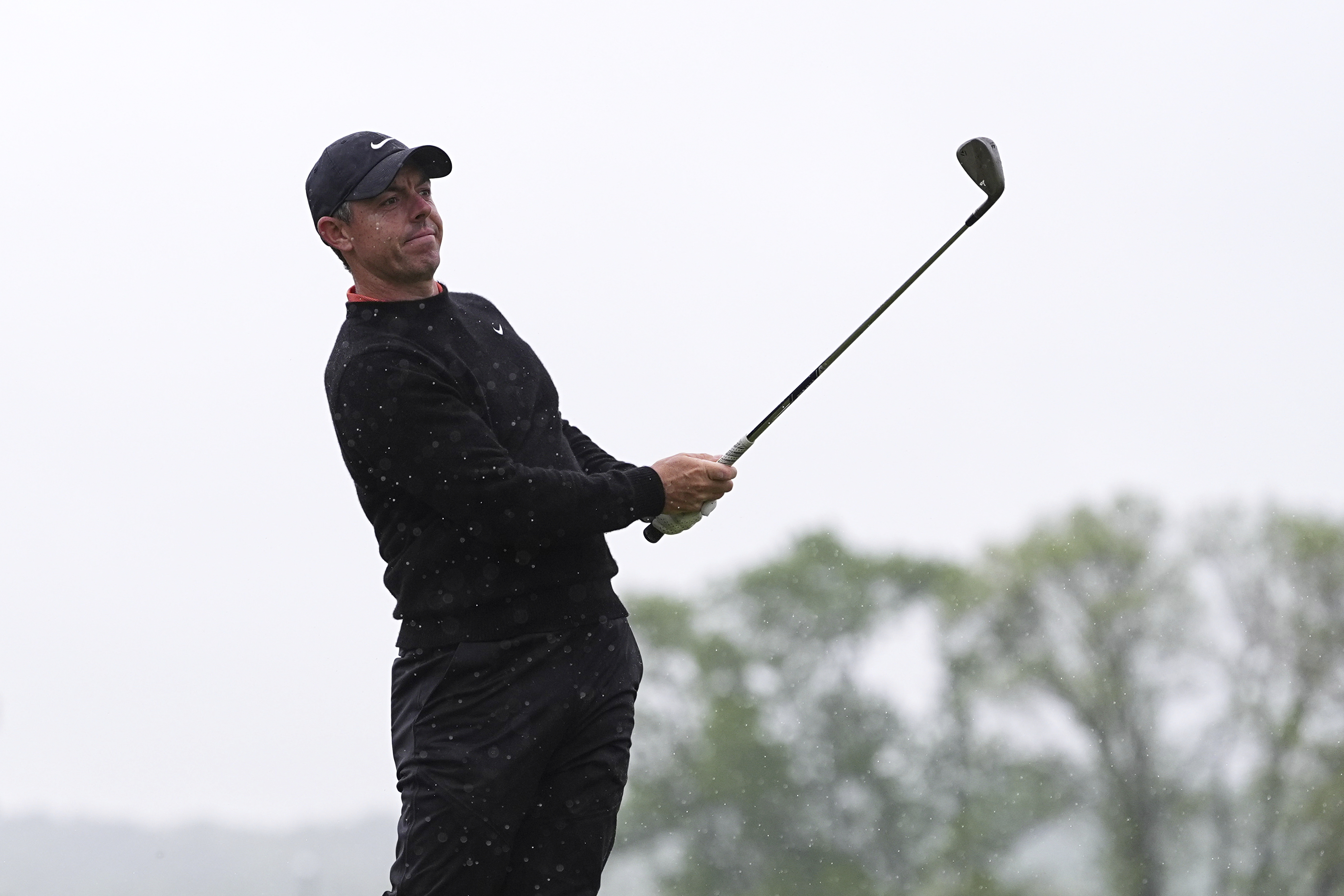 Rory McIlroy, of Northern Ireland, hits on the 14th hole during the second round of the Truist Championship golf tournament at the Philadelphia Cricket Club, Friday, May 9, 2025, in Flourtown.