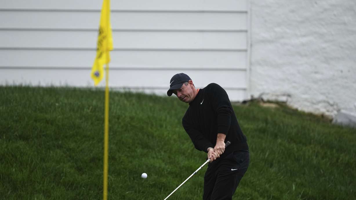 Rory McIlroy, of Northern Ireland, hits on the 13th hole during the second round of the Truist Championship golf tournament at the Philadelphia Cricket Club, Friday, May 9, 2025, in Flourtown.