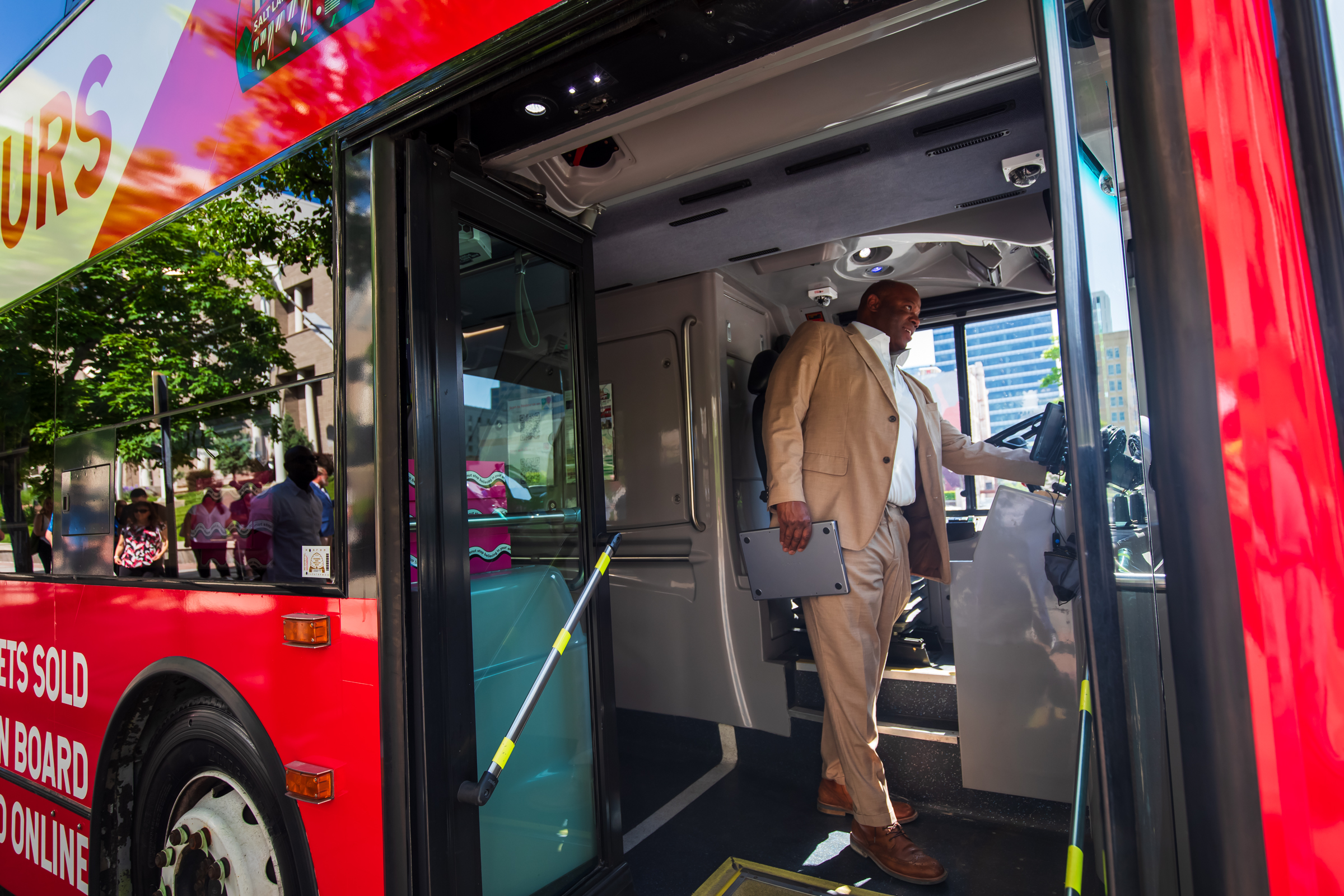 Maurice "Moe" Egan starts up his sightseeing bus, Salt Lake City Hop On Hop Off, for the first ride in Salt Lake City on Friday. The bus provides a mix of city history and ways for people to explore around the city.
