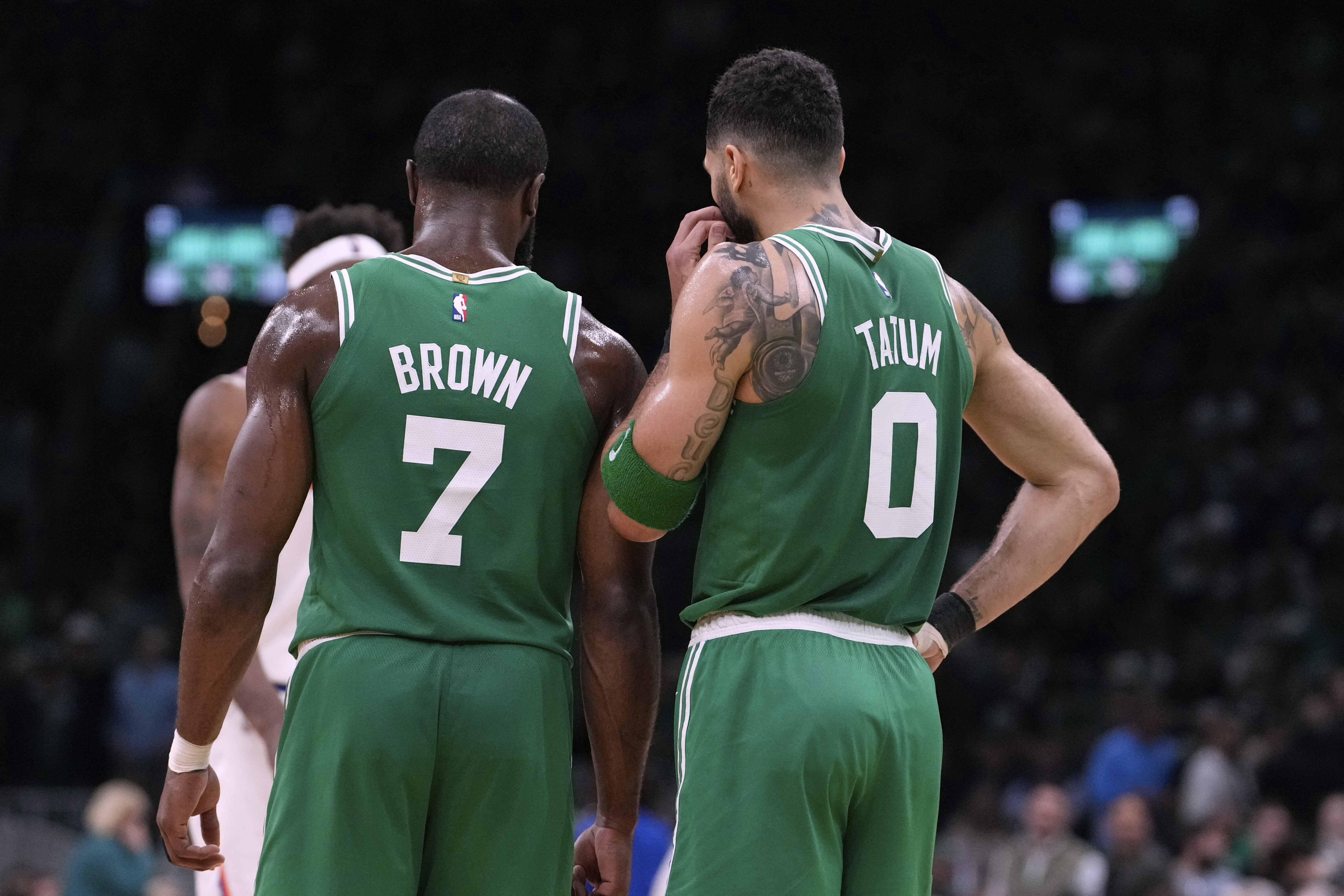 Boston Celtics forward Jayson Tatum (0) and guard Jaylen Brown (7) talk during the second half of Game 2 of an NBA basketball second-round playoff series against the New York Knicks, Wednesday, May 7, 2025, in Boston.