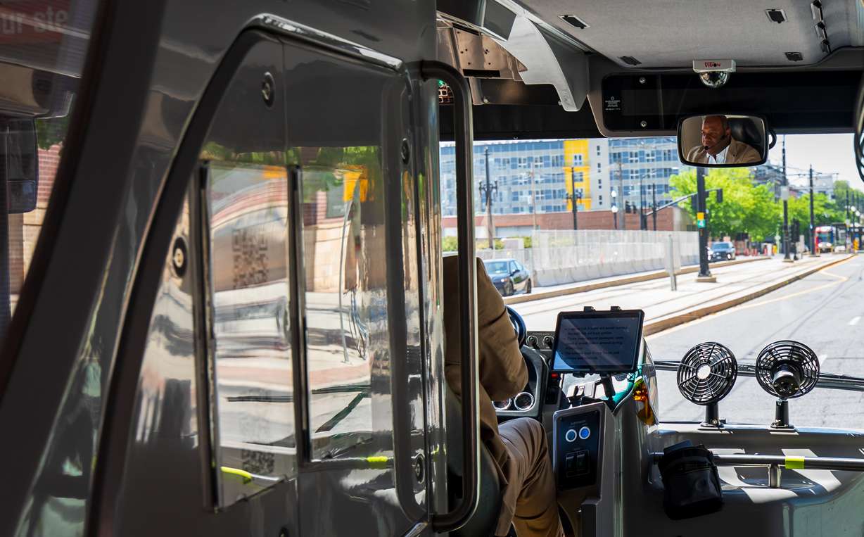 Maurice "Moe" Egan drives his sightseeing bus, Salt Lake City Hop On Hop Off, in Salt Lake City on Friday. The bus provides a mix of city history and ways for people to explore around the city.