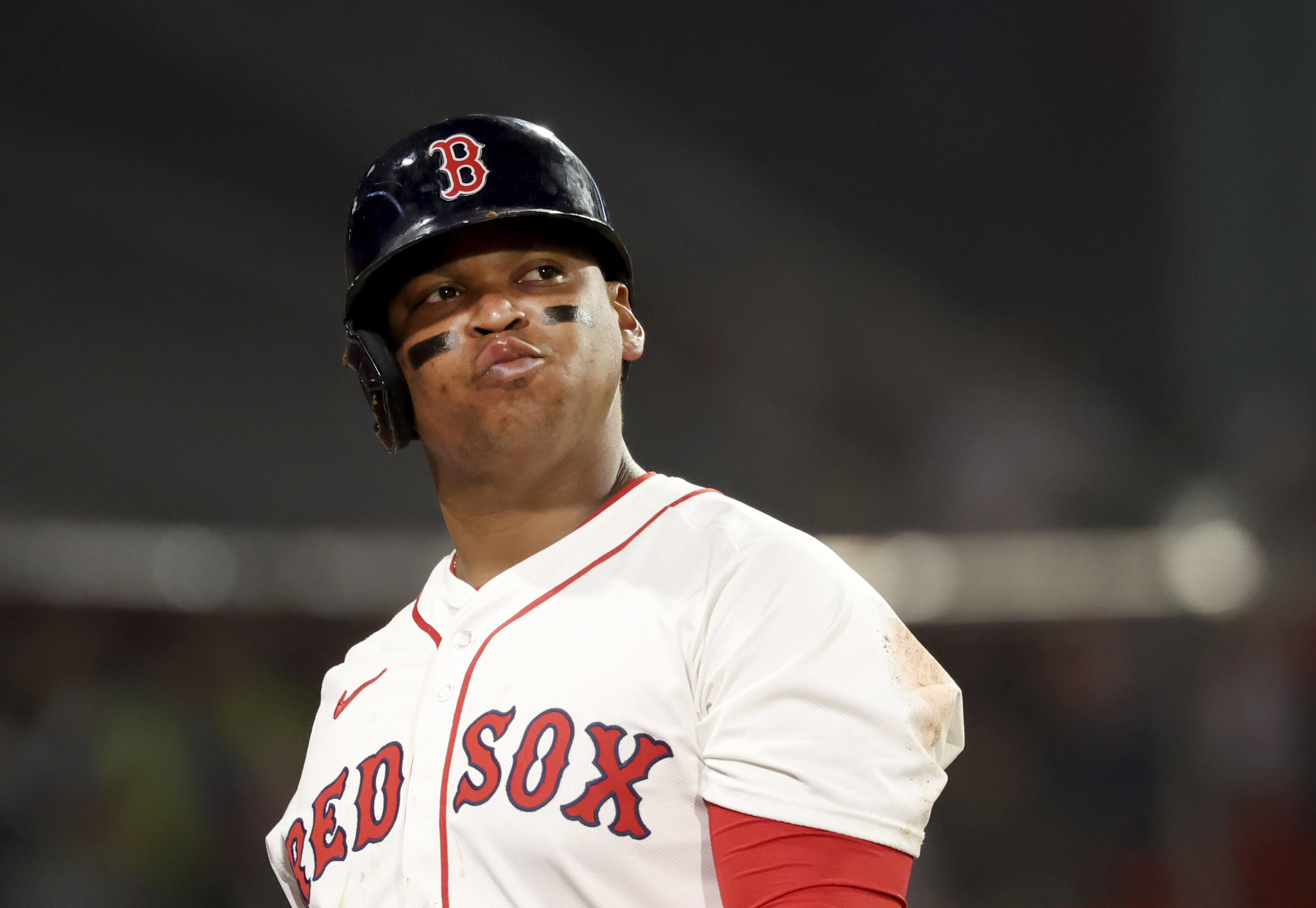 Boston Red Sox designated hitter Rafael Devers reacts after striking out during the eighth inning of a baseball game against the Texas Rangers, Tuesday, May 6, 2025, in Boston.