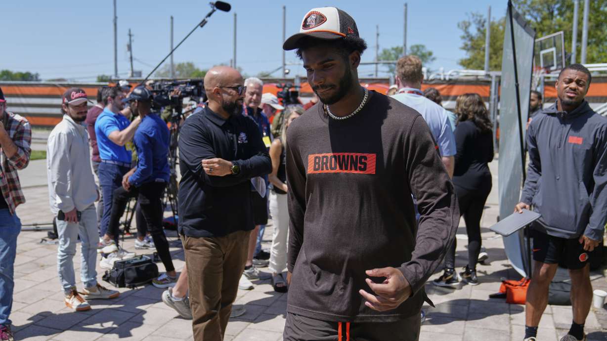 Cleveland Browns quarterback Shedeur Sanders (12) leaves a news conference during the NFL football team's rookie minicamp in Berea, Ohio, Saturday, May 10, 2025.