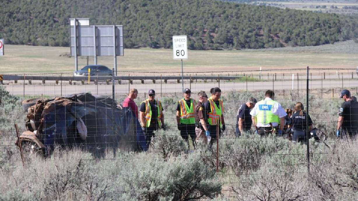 Responders prepare an injured person for medical transport following a rollover crash off Interstate 15 just south of Cedar City on Saturday.